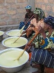 Women Stirring Shea Butter